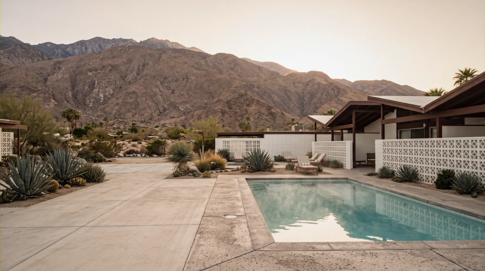Palm-lined mineral pool at dusk below Mount San Jacinto, Desert Hot Springs hotels, California