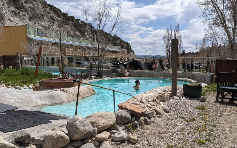Rustic soaking pools and cabins at Cottonwood Hot Springs Inn & Spa, a hot springs inn near Buena Vista, Colorado
